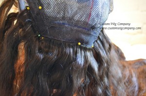 The bottom piece of wefting pinned into place for sewing